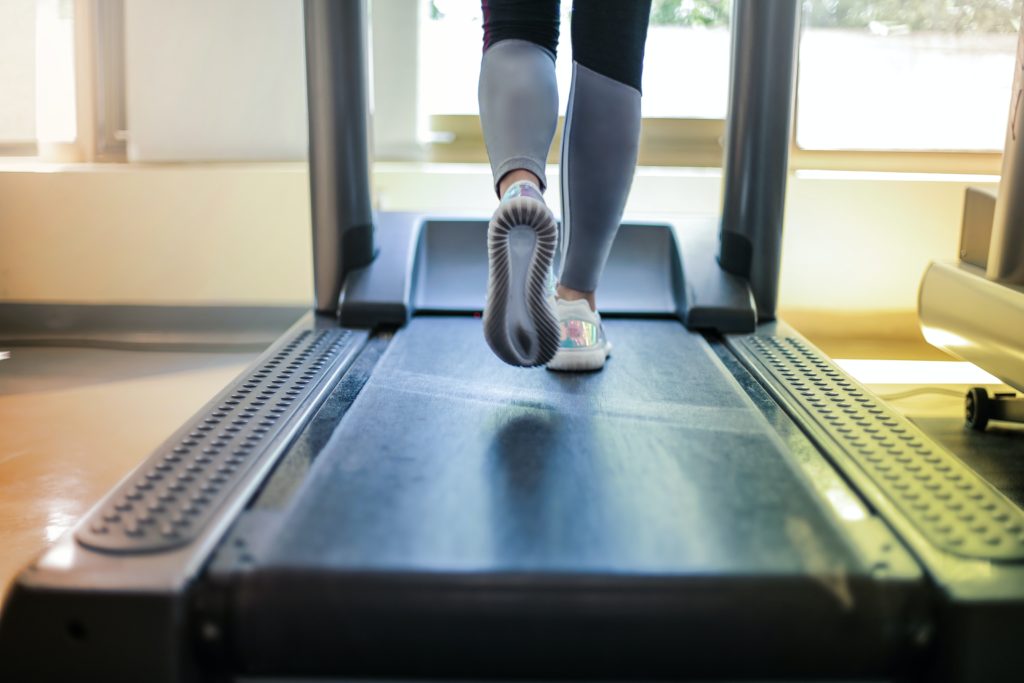 feet running on treadmill in the fitness center