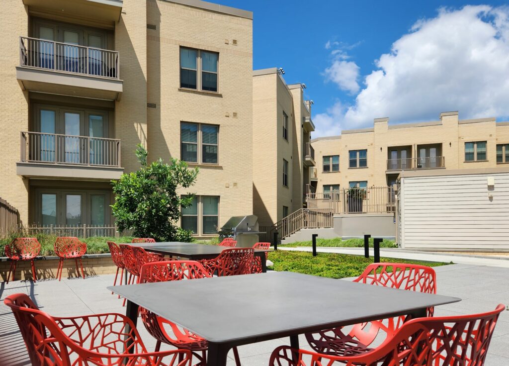 courtyard grilling area with apartments in the background at crest apartments in washington dc