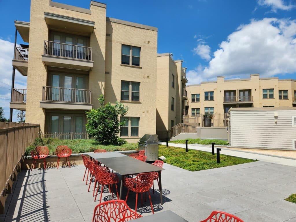 courtyard grilling area with apartments in the background at crest apartments in washington dc