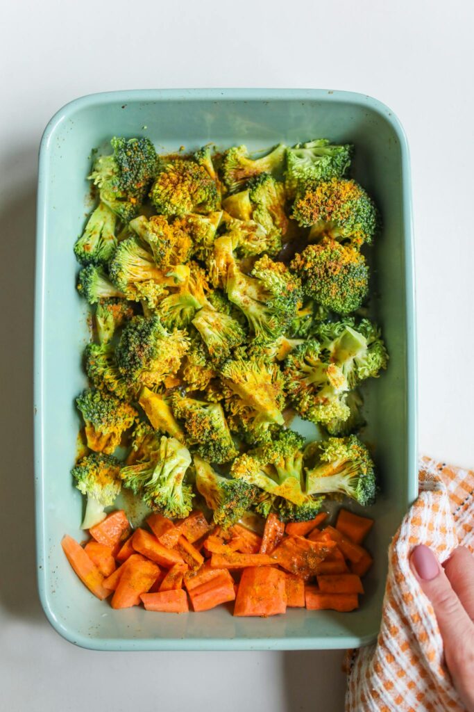 Healthy roasted broccoli and carrots in a baking tray, perfect for nutritious meals.